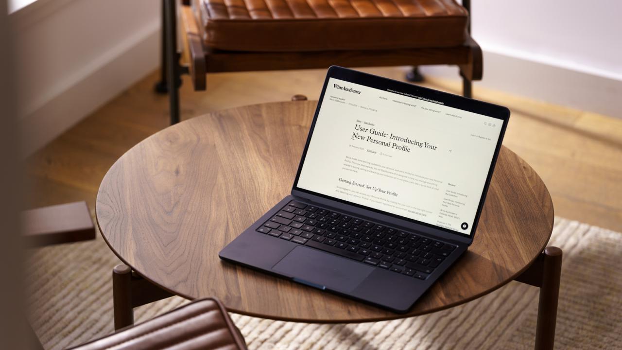 Laptop on Table showing user guide page